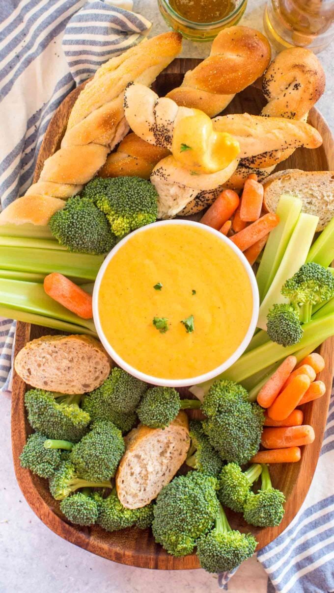Photo of beer cheese dip and veggies on a tray.
