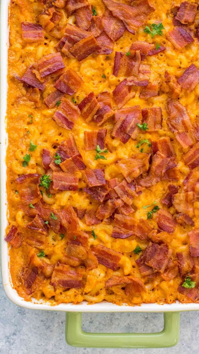 Buffalo Chicken Mac and Cheese Casserole topped with crunchy bacon bits