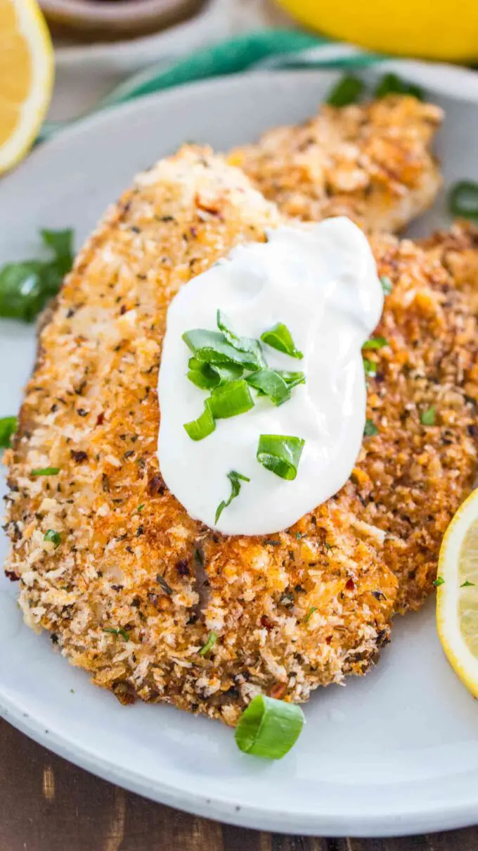 Photo of homemade baked tilapia on a plate.