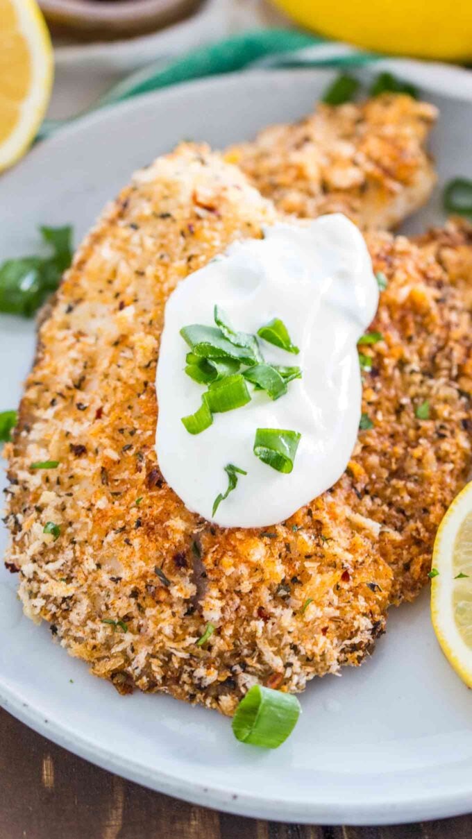 Photo of homemade baked tilapia on a plate.