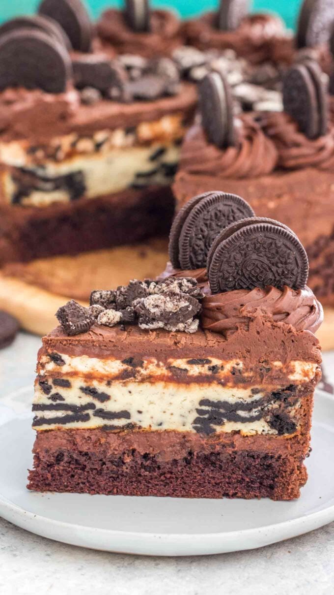 Image of sliced oreo cheesecake on a white plate. 