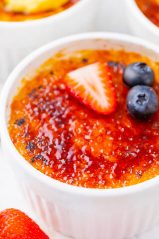 Creme brulee topped with berries.