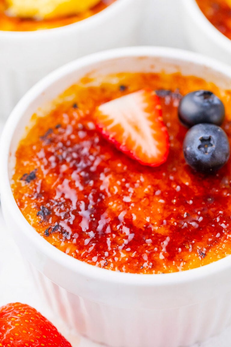 Creme brulee topped with berries.