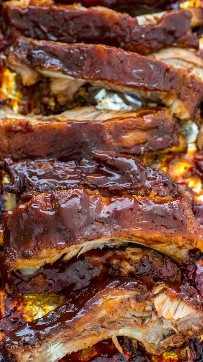 juicy oven baked barbecue ribs on a baking sheet