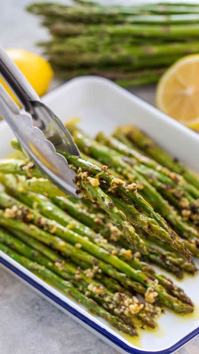 Roasted asparagus with lemon on a baking dish