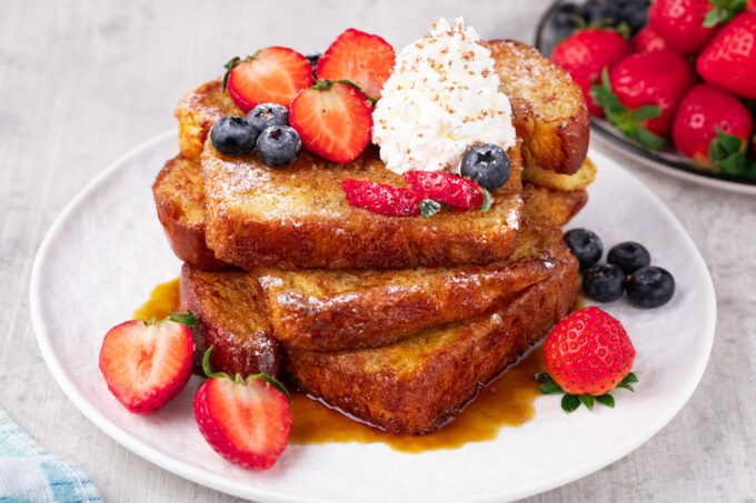 Stacked slices of brioche French toast.