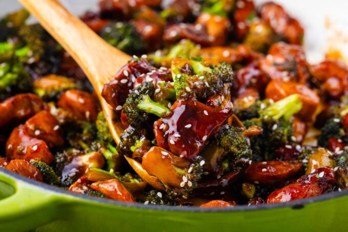 A spoonful of perfectly cooked chicken and broccoli .