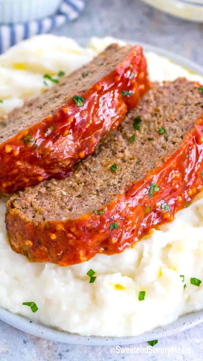 sliced meatloaf on top of mashed potatoes