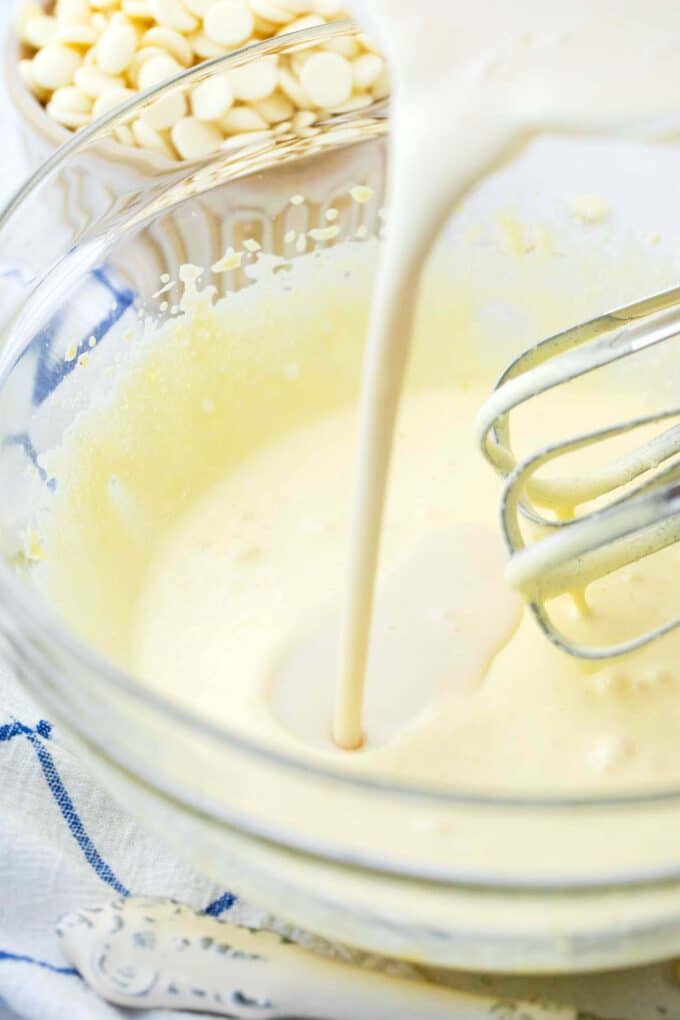 Combining heavy cream with melted white chocolate with beaten eggs