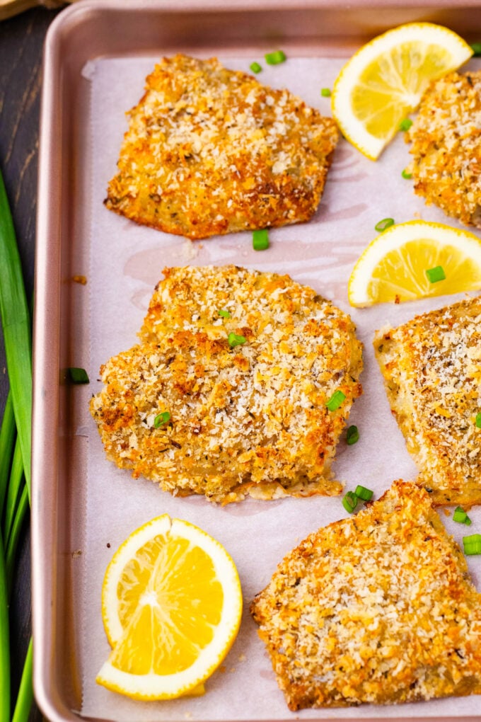 Overhead shot of crispy oven baked tilapia on a baking sheet.