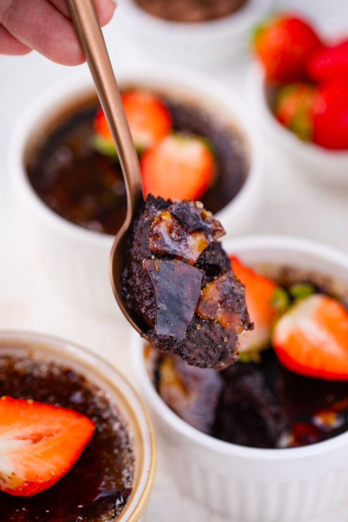 A spoonful of creamy chocolate creme brulee.