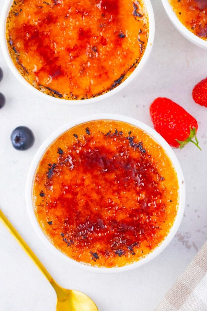 Overhead shot of homemade creme brulee in ramekins.