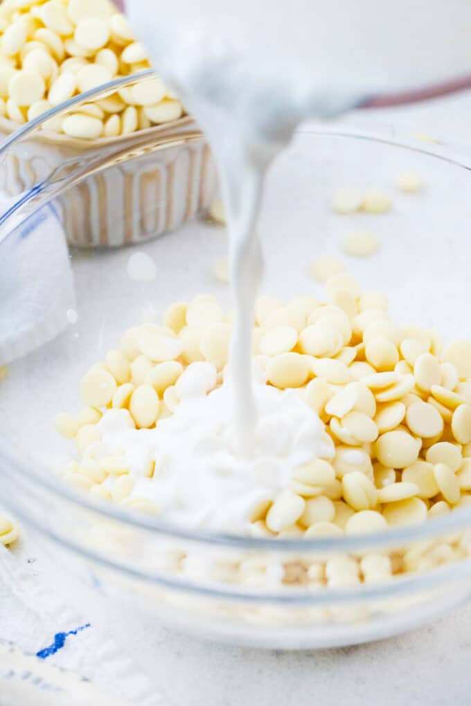 adding heavy cream to white chocolate chips