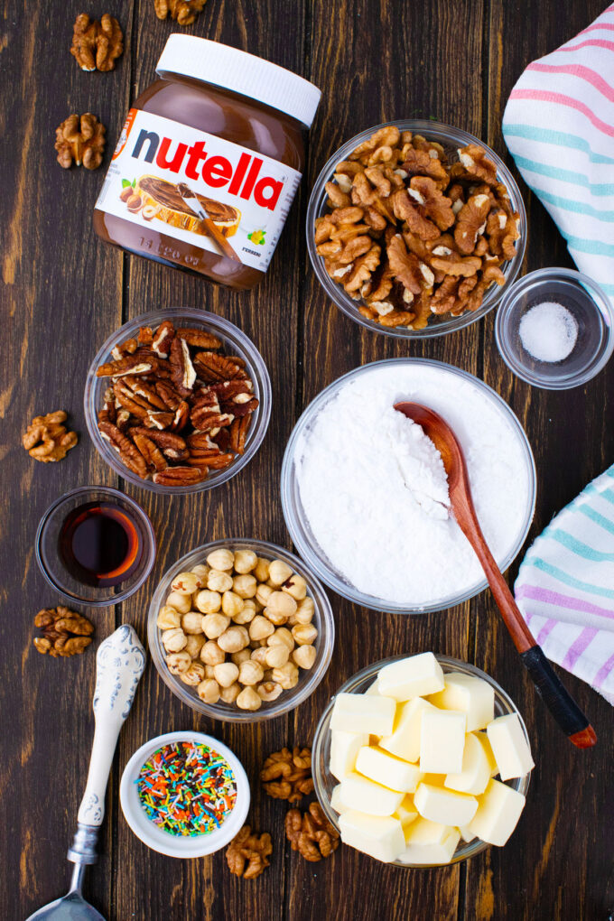 Overhead shot of No-Cake Nutella fudge ingredients arranged on a wooden table.