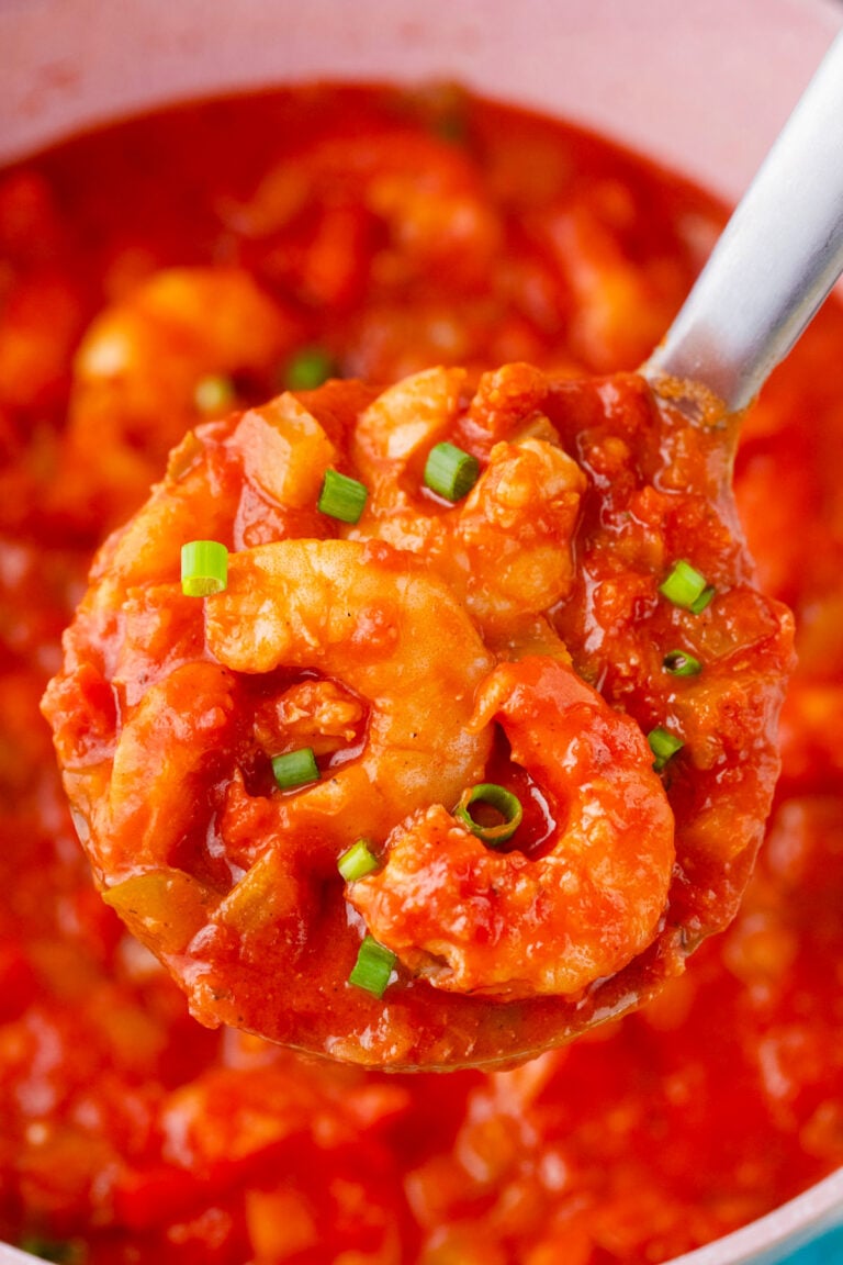 A ladle of shrimp creole.