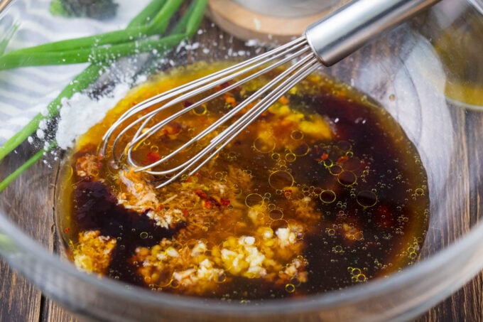 Whisking homemade teriyaki sauce.