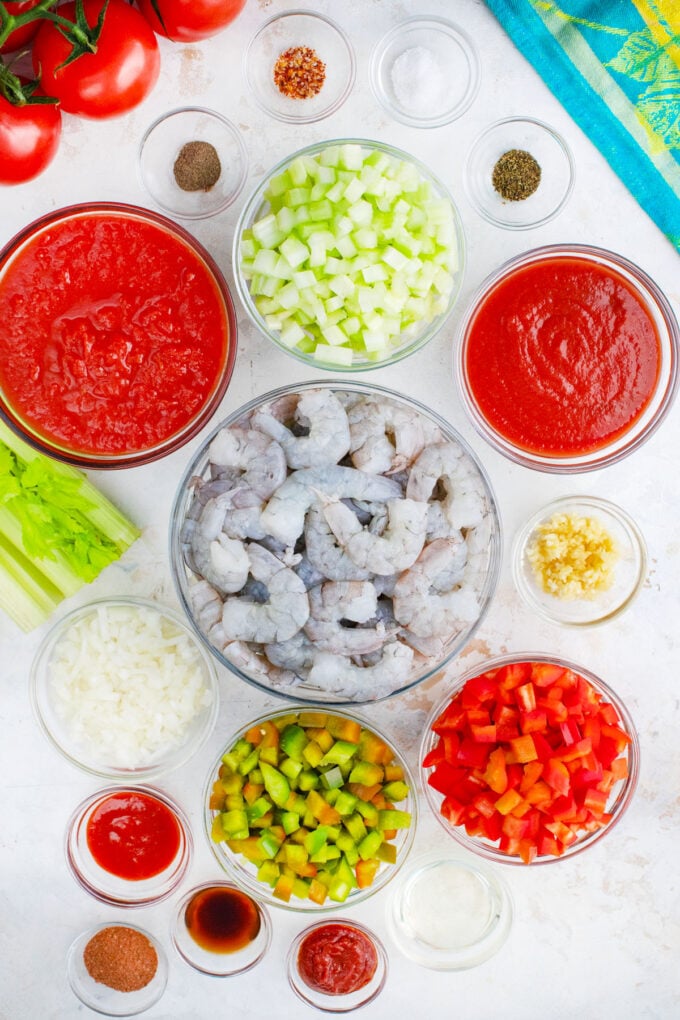Overhead shot of shrimp creole ingredients in bowls.