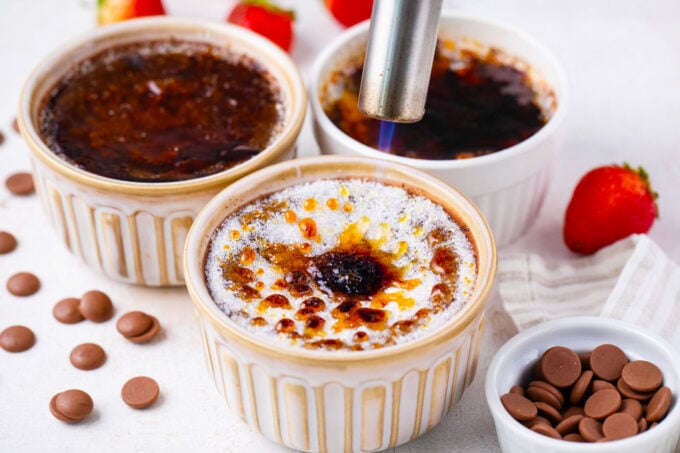 Torching the top of chocolate creme brulee.