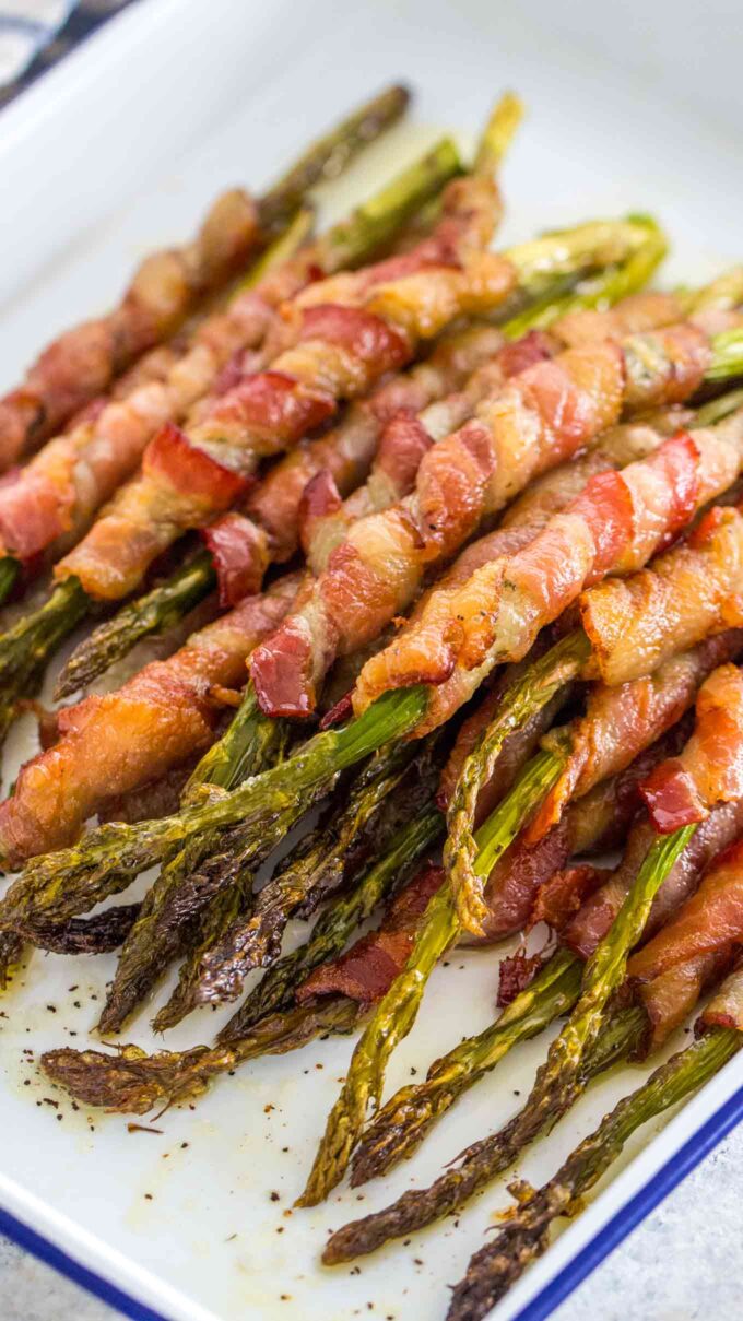 Picture of homemade baked asparagus wrapped with bacon. 