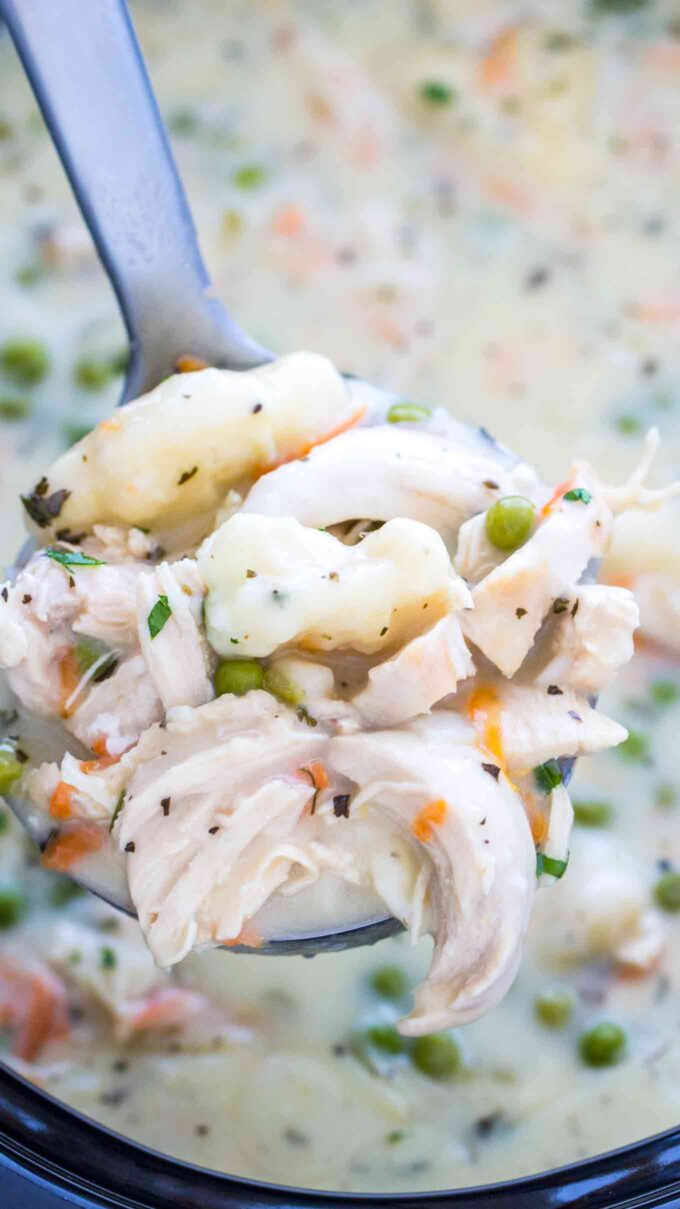 Crockpot chicken and dumplings in a silver spoon