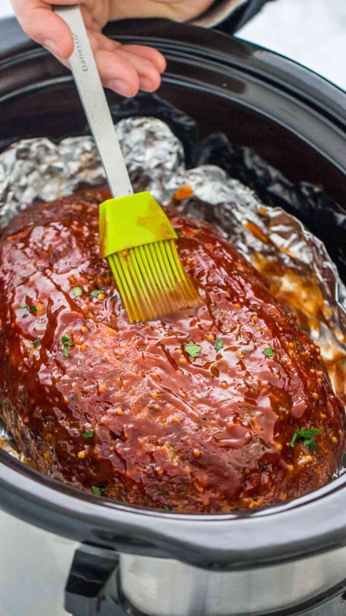 Image of crockpot meatloaf glazed with barbecue sauce.