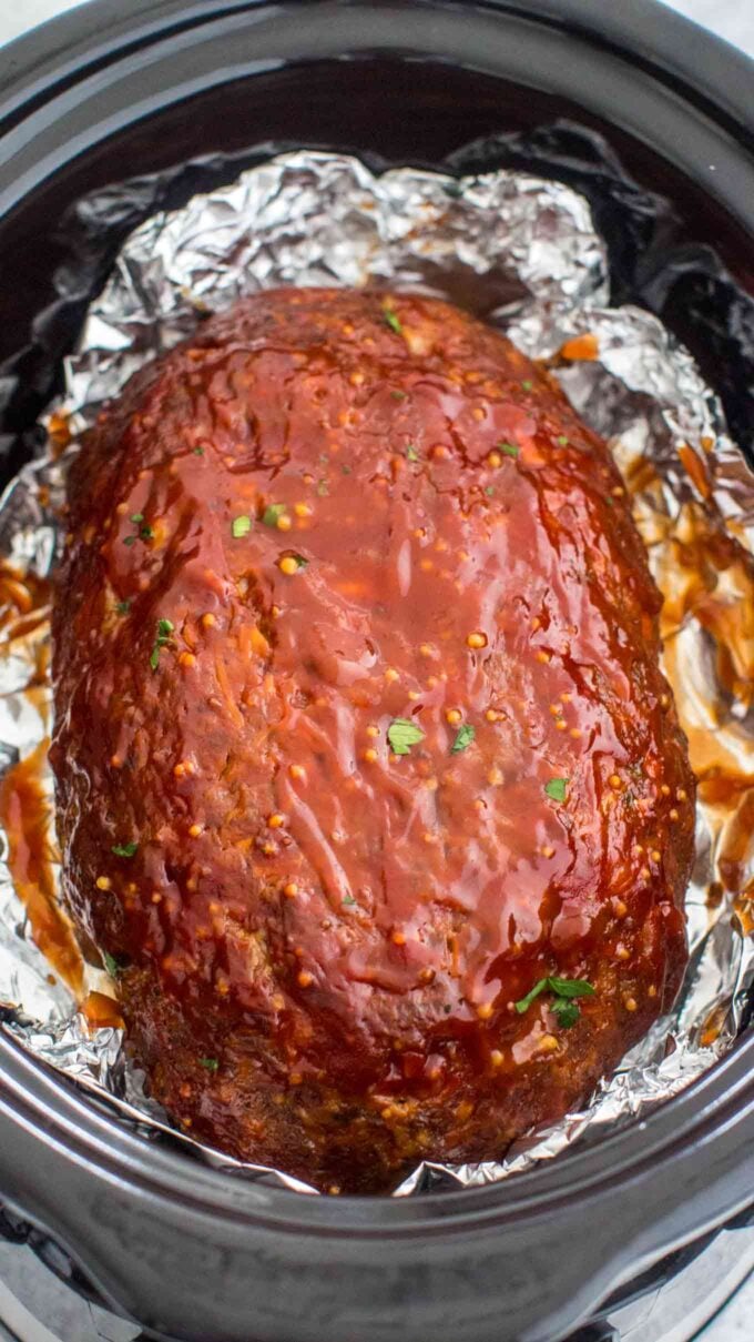 Freshly slow cooker meatloaf glazed with bbq sauce. 