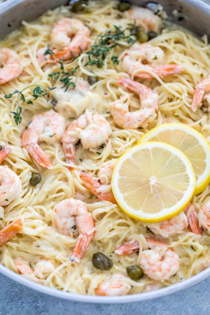 Picture of pasta with garlic shrimp and parmesan in a skillet. 