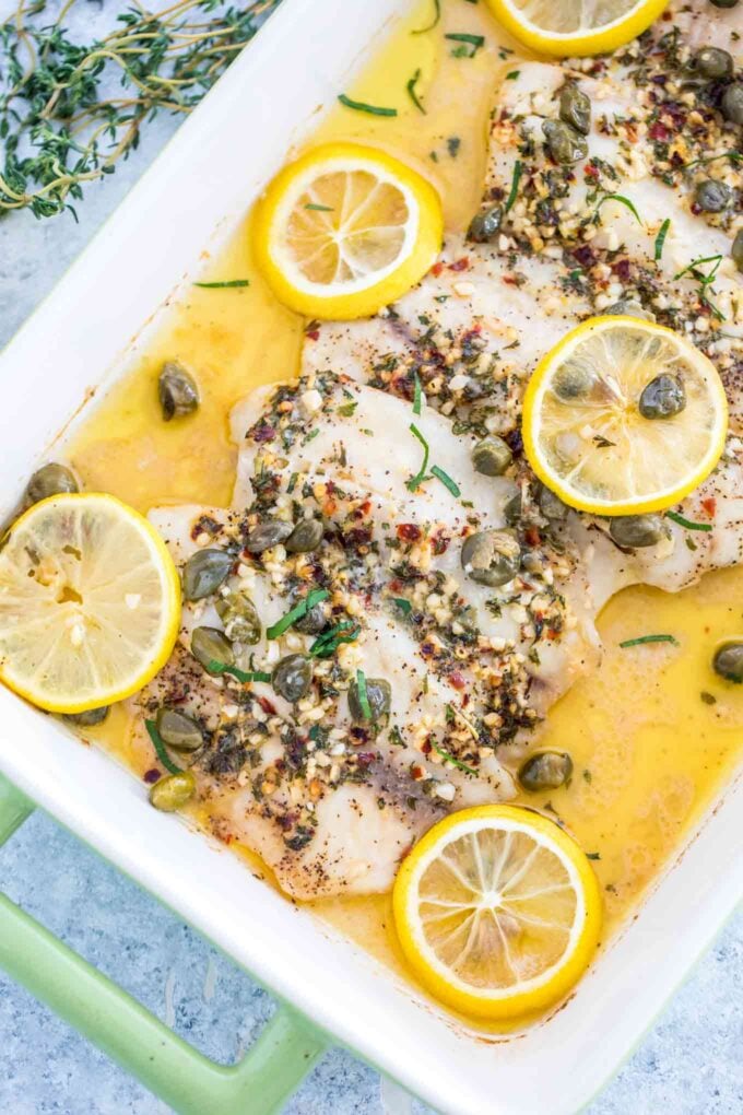 Image of oven baked tilapia with sliced lemon.