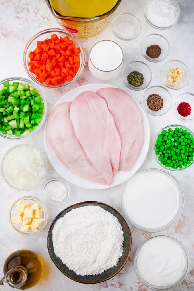 Overhead shot of Instant Pot chicken and dumplings ingredients in bowls.