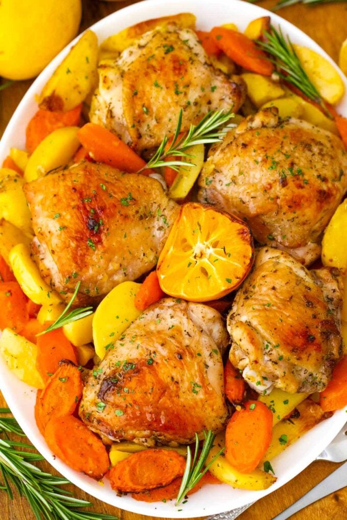Overhead shot of Italian chicken and potatoes on a serving plate.