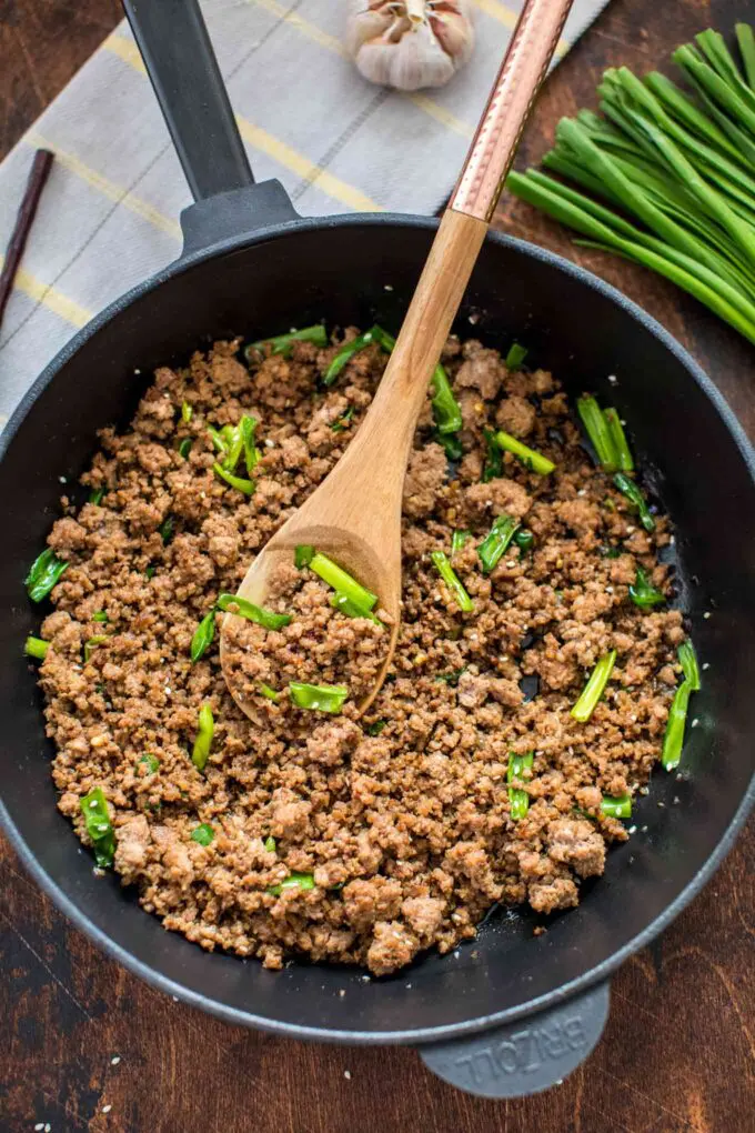 Korean ground beef with scallions in a skillet.