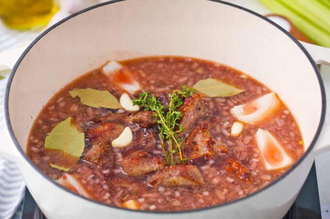 Beef stew in a Dutch oven before going into the oven.