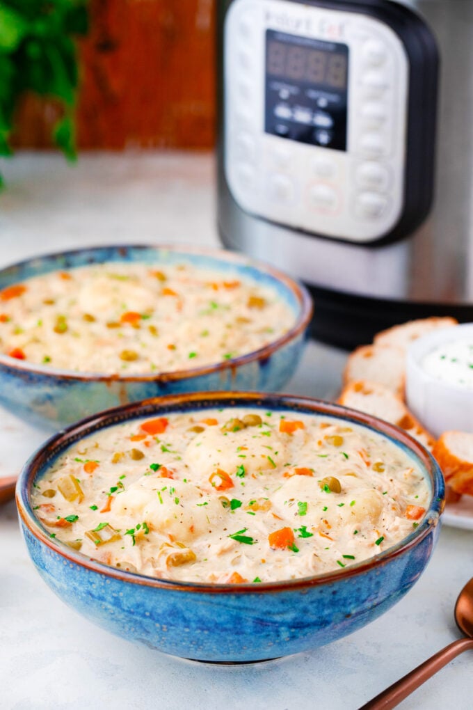 Bowls of Instant Pot chicken and dumplings