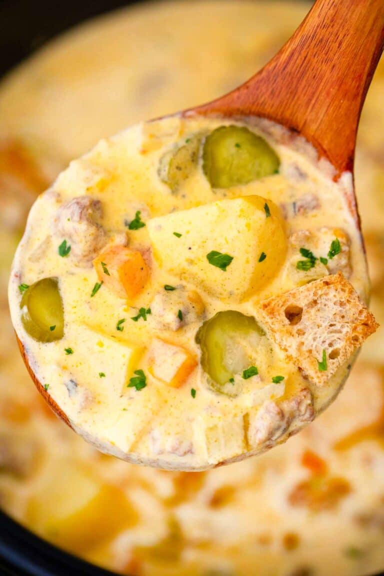 close shot of a ladle filled with crockpot cheeseburger soup