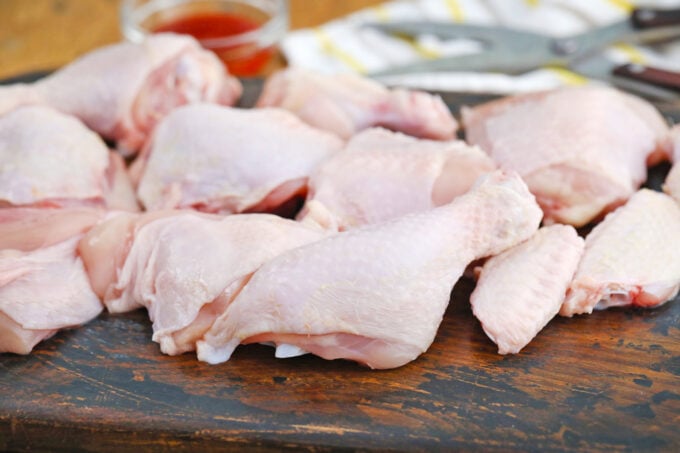 Chicken pieces on a cutting board.