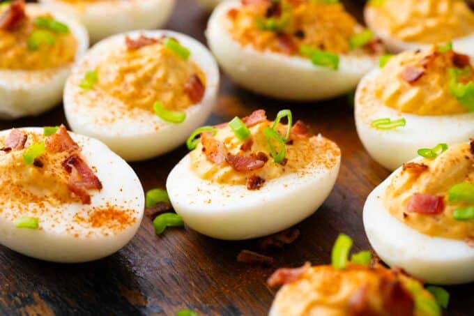 deviled eggs on a serving board