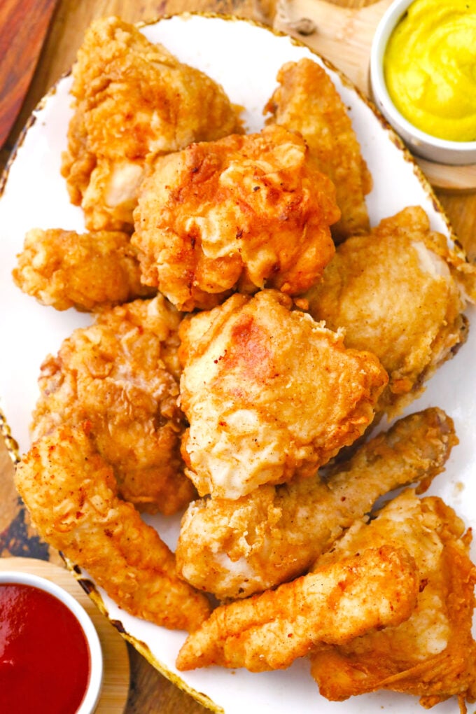 Overhead shot of a plate with crunchy homemade fried chicken.