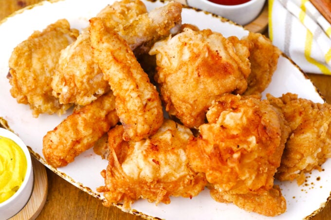 A serving plate with crunchy homemade fried chicken.