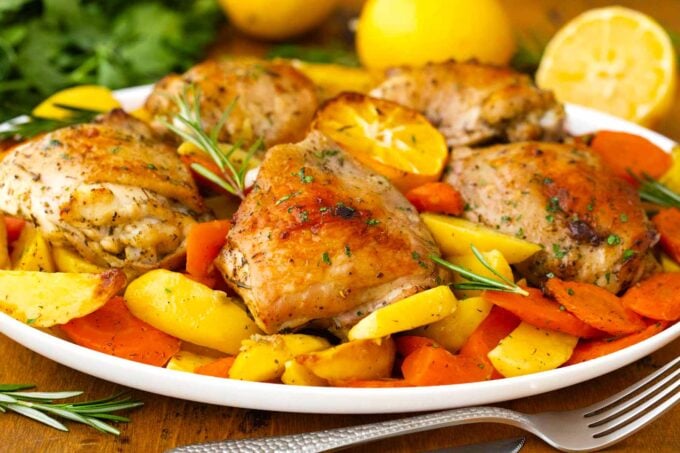 A platter of Italian chicken and potatoes.