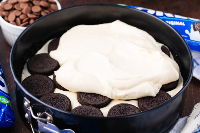 Assembling Oreo cheesecake.