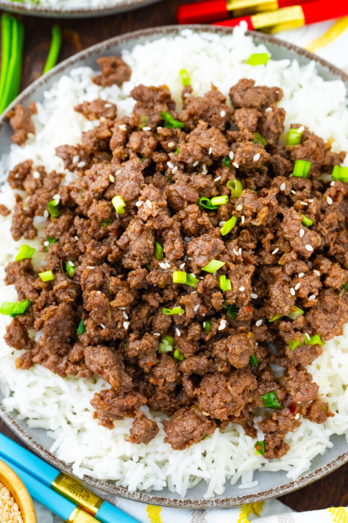 Overhead shot of Korean ground beef topped with chopped green onions and sesame seeds.
