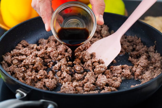 Pouring soy sauce into Korean ground beef.