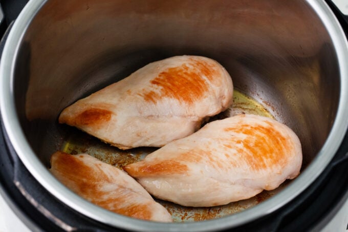 Searing chicken breasts in the Instant Pot.
