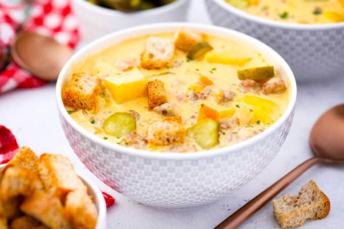 a bowl of slow cooker cheeseburger soup topped with croutons