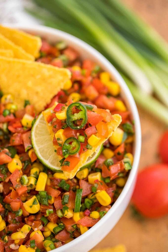 pico de Gallo on a corn chip on top of a lime