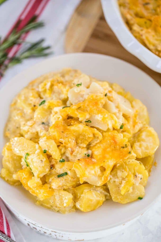 Image of instant pot scalloped potatoes on a white plate.