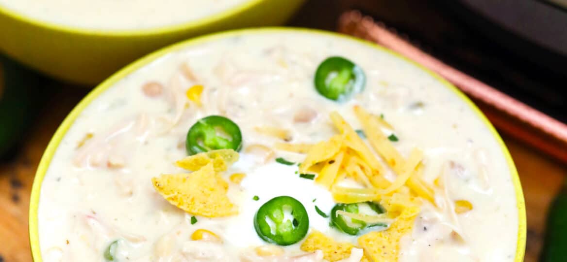Instant Pot White Chicken Chili is one of our favorite pressure cooker recipes! It is a hearty meal that is made in a fraction of the time compared to the traditional version. #instantpotrecipes #pressurecookerrecipes #chili #whitechili #sweetandsavorymeals