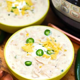 Instant Pot White Chicken Chili is one of our favorite pressure cooker recipes! It is a hearty meal that is made in a fraction of the time compared to the traditional version. #instantpotrecipes #pressurecookerrecipes #chili #whitechili #sweetandsavorymeals