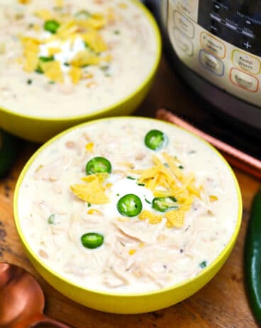 Instant Pot White Chicken Chili is one of our favorite pressure cooker recipes! It is a hearty meal that is made in a fraction of the time compared to the traditional version. #instantpotrecipes #pressurecookerrecipes #chili #whitechili #sweetandsavorymeals