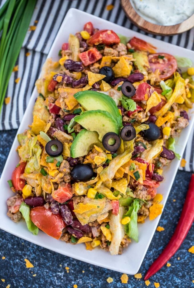 Overhead shot of homemade taco salad with ground beef veggies and chips